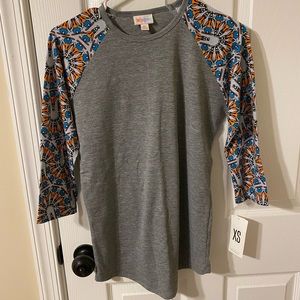 LuLaRoe Randy Tee size XS. Disney goofy on sleeve. NWT